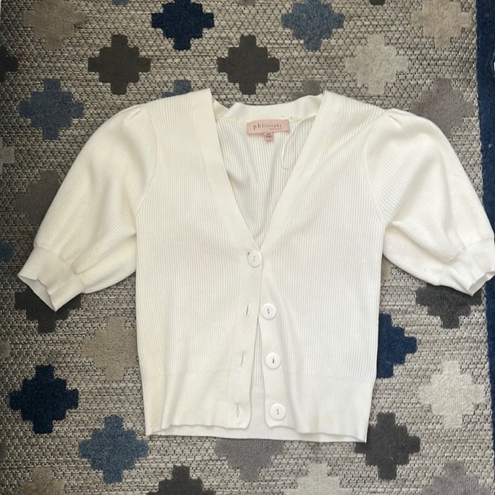 sweater from philosophy with tight bands at the arm at waist